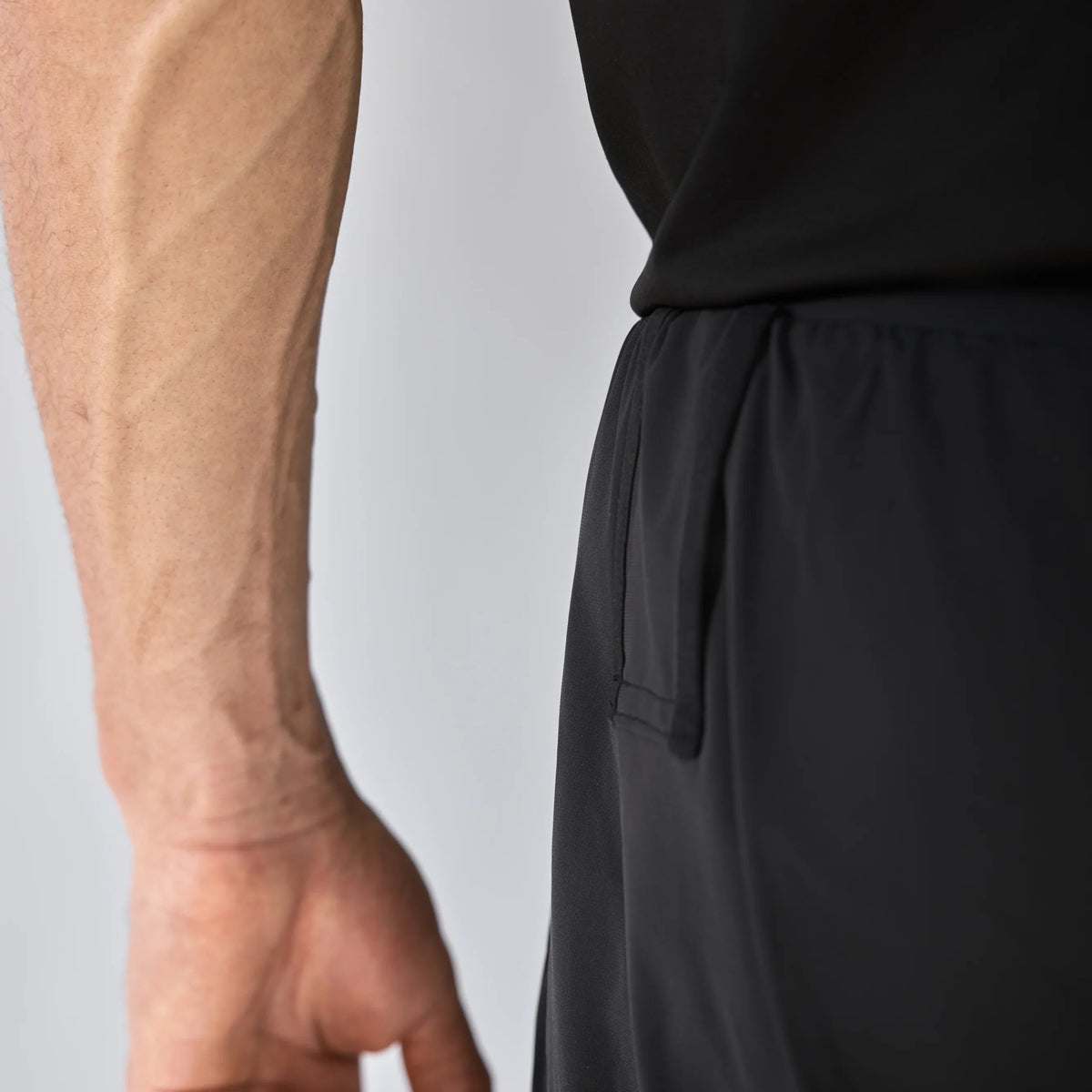 Vexo MatchMove Shorts – lightweight, breathable tennis shorts with built-in compression layer, towel holder, and zip pockets for secure storage.