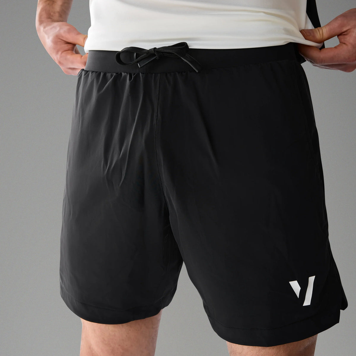 Vexo MatchMove Shorts – lightweight, breathable tennis shorts with built-in compression layer, towel holder, and zip pockets for secure storage.