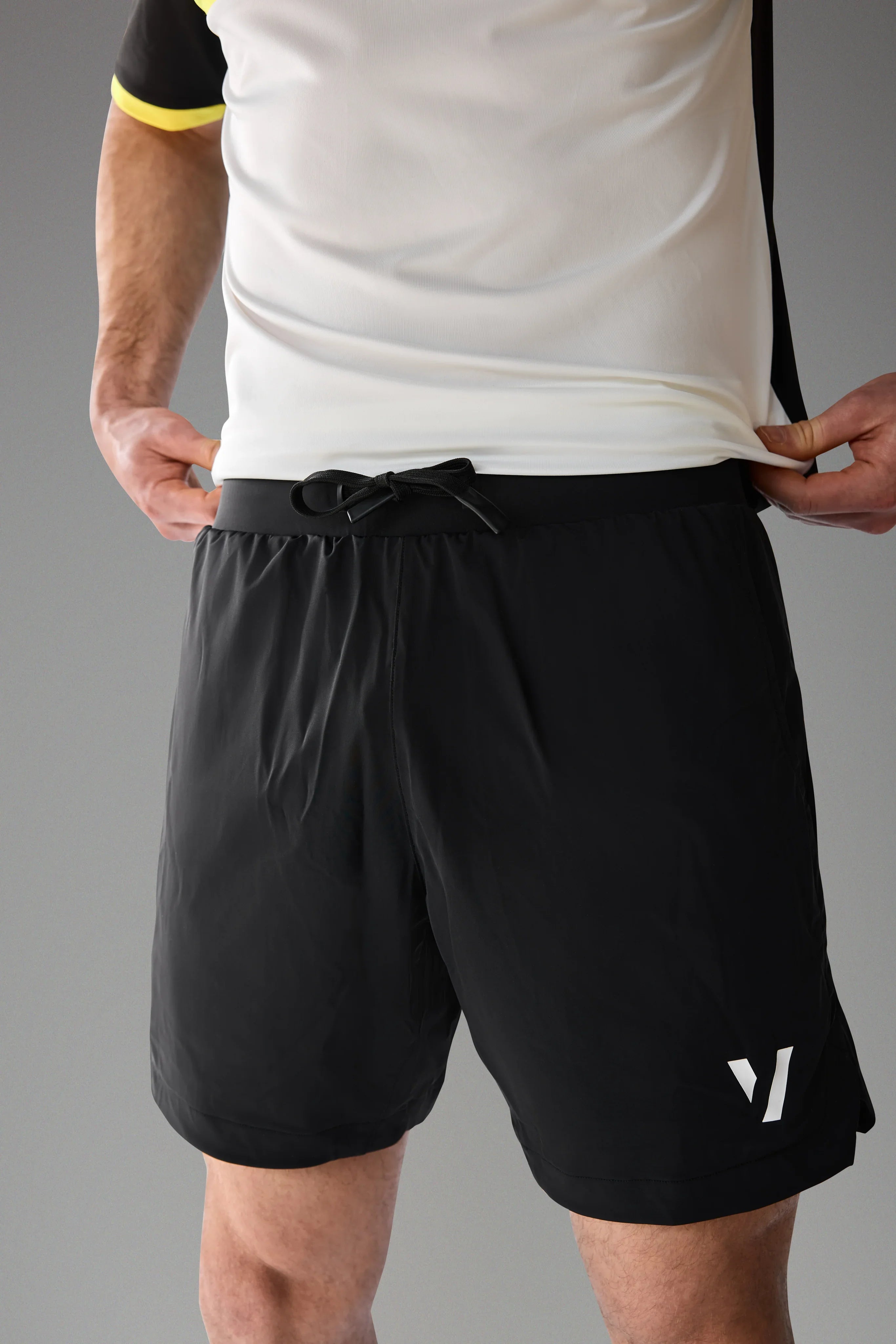 Vexo MatchMove Shorts – lightweight, breathable tennis shorts with built-in compression layer, towel holder, and zip pockets for secure storage.