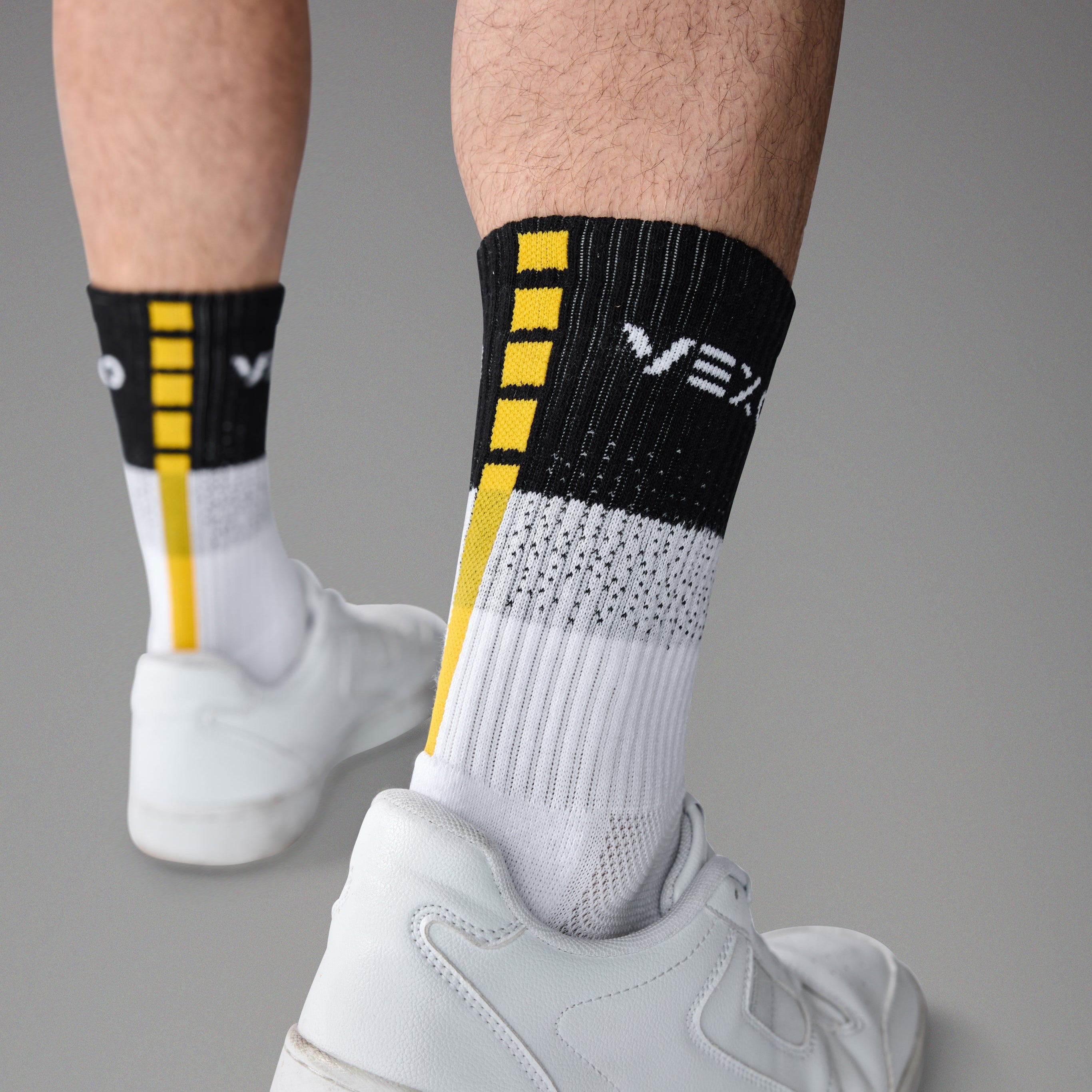 man wearing tennis socks with grip zones at the soles