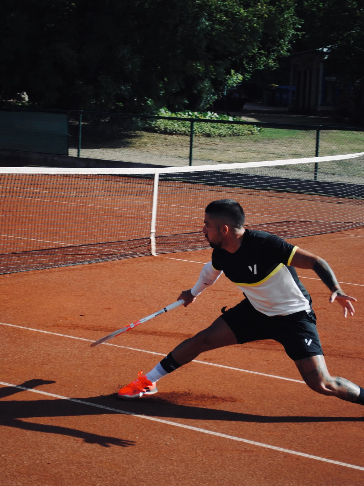 Semi-professional tennis player playing in Vexo clothing. 