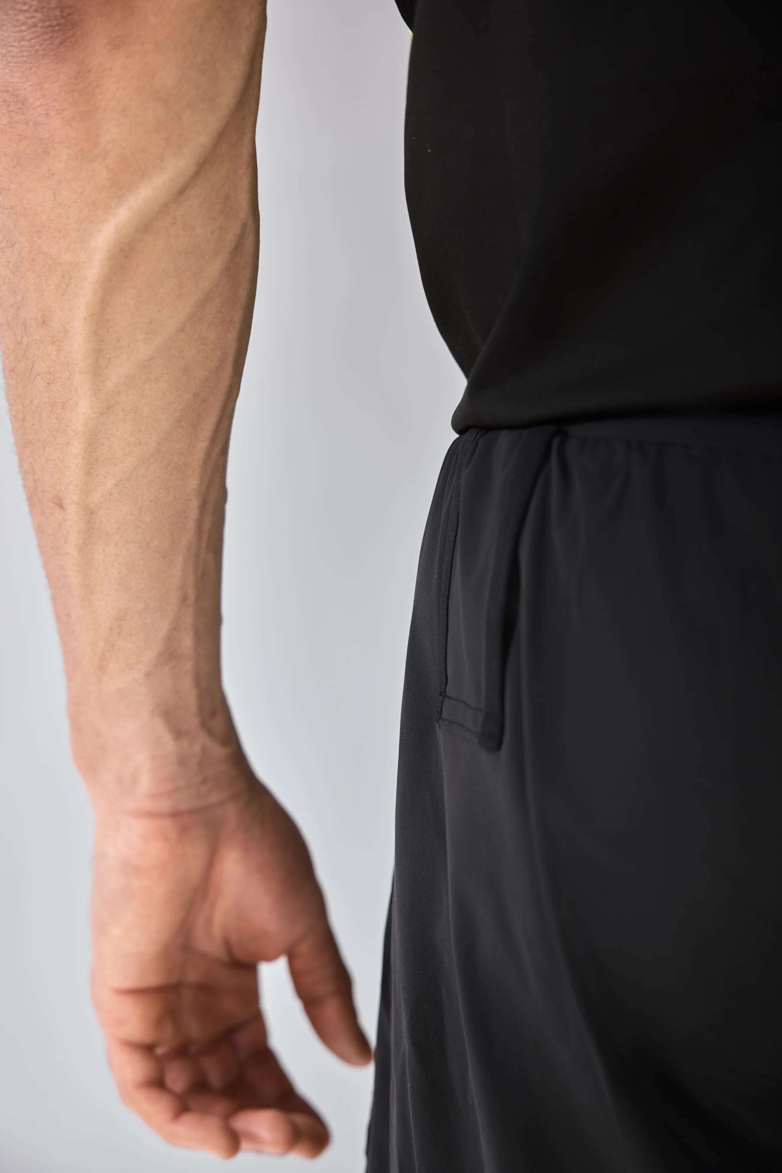 Vexo MatchMove Shorts – lightweight, breathable tennis shorts with built-in compression layer, towel holder, and zip pockets for secure storage.