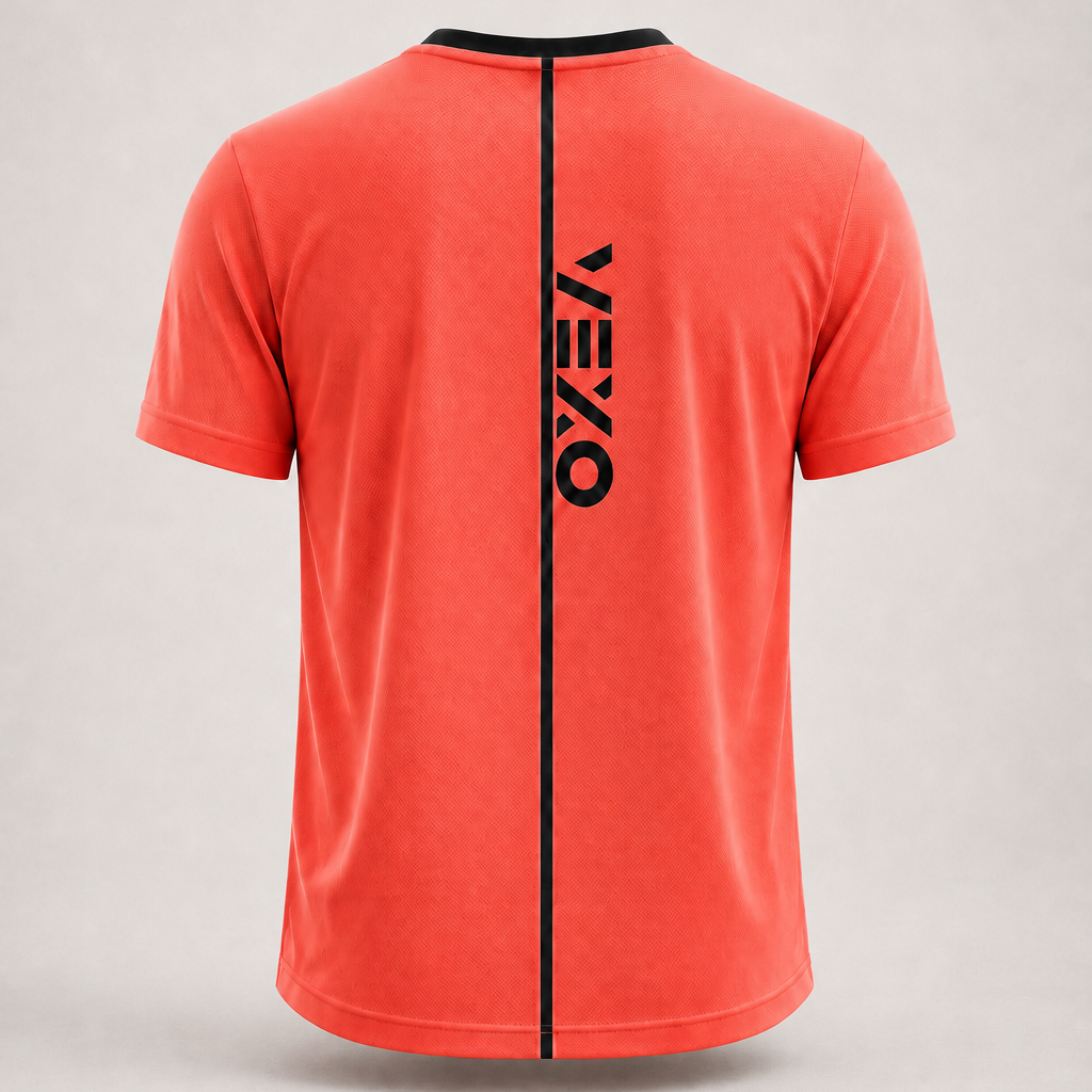 A coral red short-sleeve t-shirt shown from the back, featuring a vertical black zipper detail down the center with the brand name 'VEXO' printed vertically in black. The shirt is displayed on a neutral light gray background.